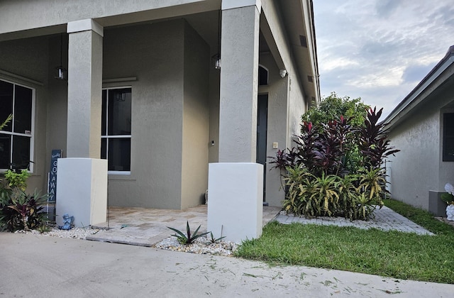 7861 Manor Forest Ln, Boynton Beach, FL 33436 - view of side of home featuring stucco siding