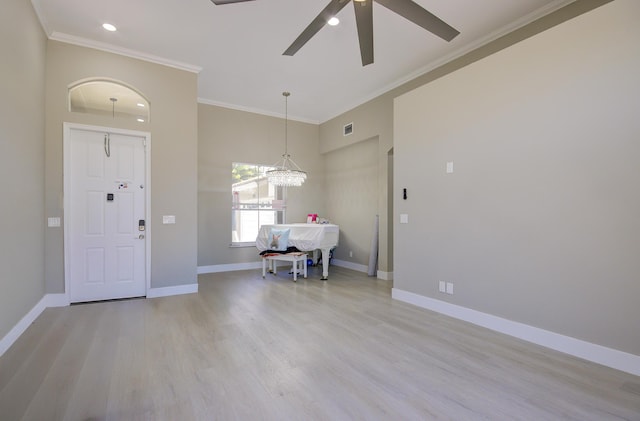 7861 Manor Forest Ln, Boynton Beach, FL 33436 - entrance foyer featuring a ceiling fan, light wood-type flooring, baseboards, ornamental molding, and a chandelier