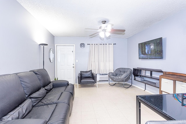 1043 NE 20th St, Belle Glade, FL 33430 - living area featuring baseboards, a ceiling fan, a textured ceiling, and cooling unit