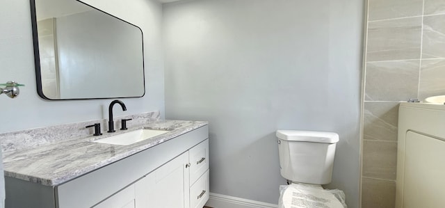 4141 NW 44th Ave Unit 217, Lauderdale Lakes, FL 33319 - bathroom featuring vanity, baseboards, and toilet