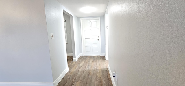 4141 NW 44th Ave Unit 217, Lauderdale Lakes, FL 33319 - hallway with baseboards and wood finished floors