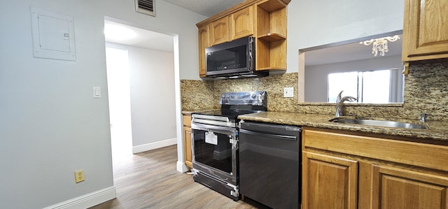 4141 NW 44th Ave Unit 217, Lauderdale Lakes, FL 33319 - kitchen featuring visible vents, black microwave, tasteful backsplash, stainless steel range with electric cooktop, and dishwashing machine