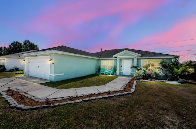 1566 SW Andalusia Rd, Port Saint Lucie, FL 34953 - ranch-style home with stucco siding, a garage, driveway, and a front lawn