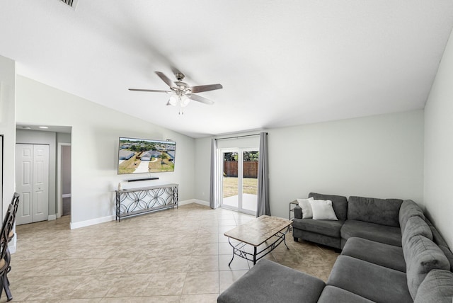1566 SW Andalusia Rd, Port Saint Lucie, FL 34953 - living room featuring a ceiling fan, baseboards, and lofted ceiling