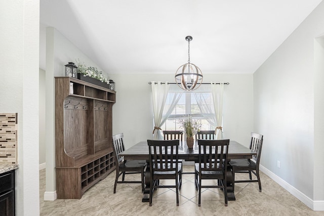 1566 SW Andalusia Rd, Port Saint Lucie, FL 34953 - dining space with an inviting chandelier, baseboards, and light tile patterned floors