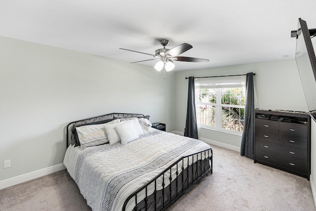 1566 SW Andalusia Rd, Port Saint Lucie, FL 34953 - bedroom featuring baseboards, ceiling fan, and light colored carpet