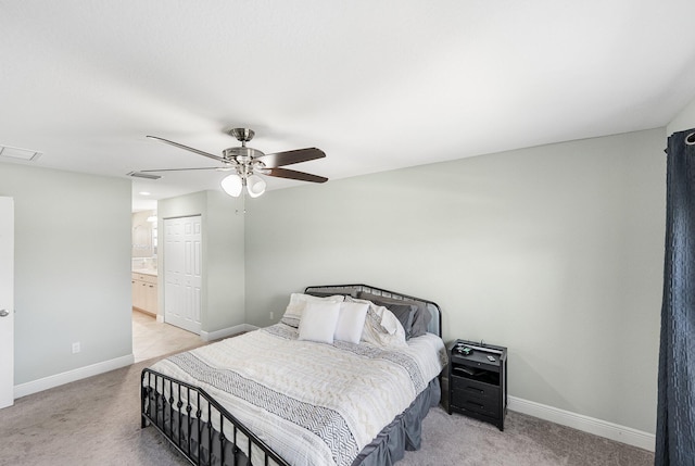 1566 SW Andalusia Rd, Port Saint Lucie, FL 34953 - bedroom with connected bathroom, light colored carpet, a ceiling fan, baseboards, and visible vents