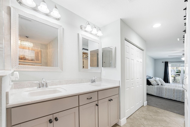1566 SW Andalusia Rd, Port Saint Lucie, FL 34953 - bathroom featuring a sink, tile patterned flooring, double vanity, and connected bathroom