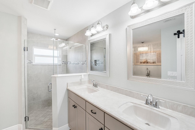1566 SW Andalusia Rd, Port Saint Lucie, FL 34953 - full bath with a sink, a shower stall, double vanity, and visible vents