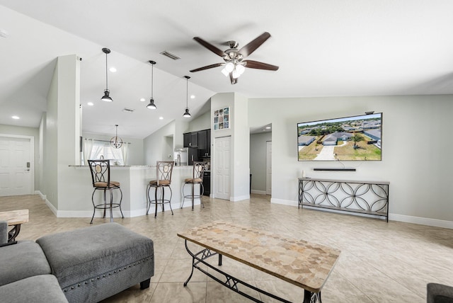 1566 SW Andalusia Rd, Port Saint Lucie, FL 34953 - living area with visible vents, baseboards, ceiling fan, light tile patterned floors, and vaulted ceiling