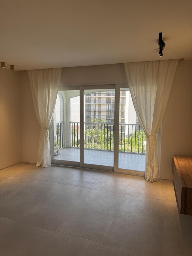 2871 N Ocean Blvd Unit R444, Boca Raton, FL 33431 - unfurnished living room with healthy amount of natural light and concrete floors