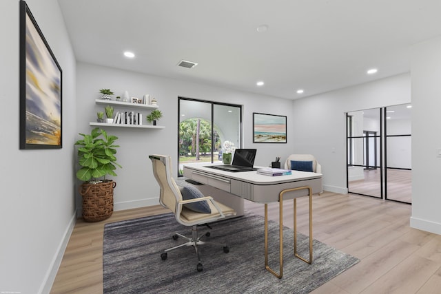 home office featuring light wood-style floors, baseboards, and recessed lighting
