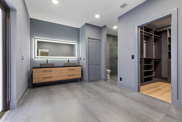unfurnished bedroom with baseboards, connected bathroom, and recessed lighting