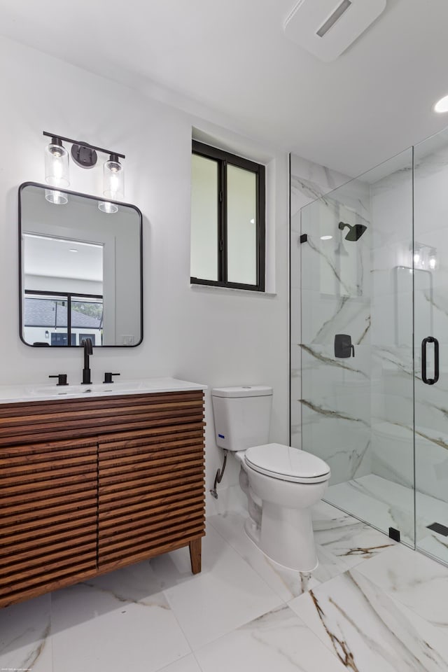 bathroom featuring a marble finish shower, toilet, vanity, and marble finish floors