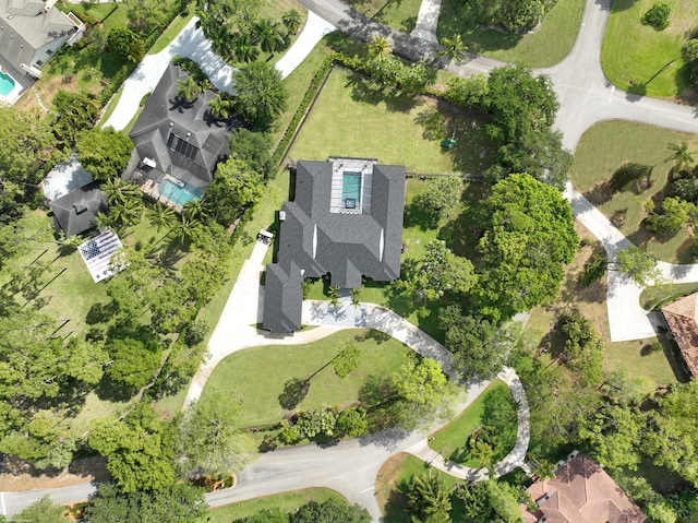 aerial view of property and surrounding area with nearby suburban area