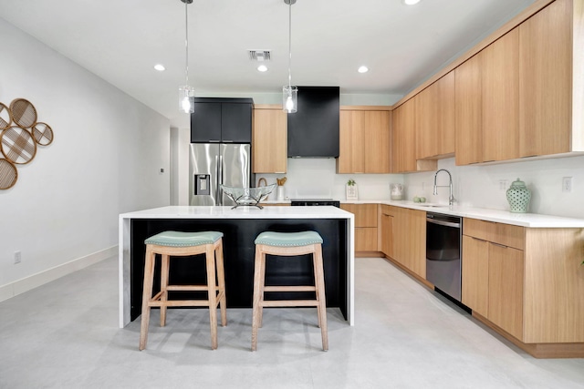 kitchen with a center island, appliances with stainless steel finishes, modern cabinets, and visible vents