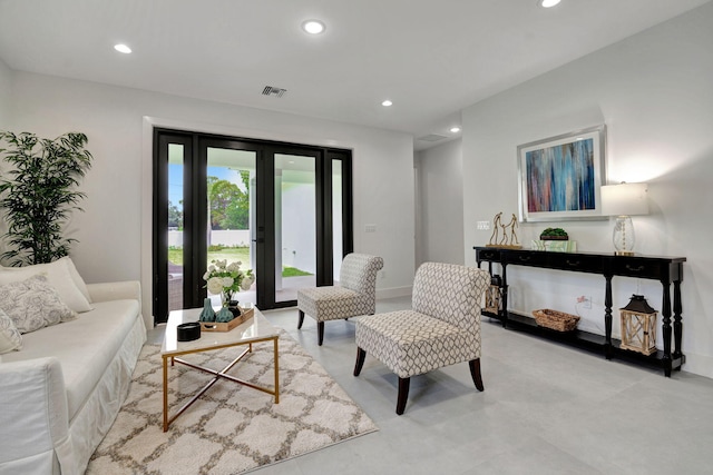 living area with baseboards, recessed lighting, and visible vents