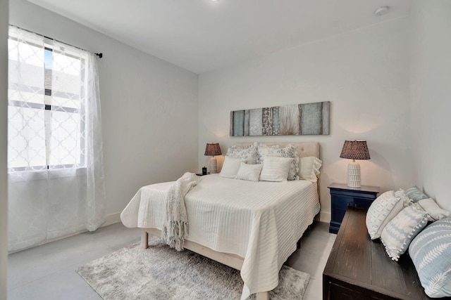 bedroom featuring baseboards