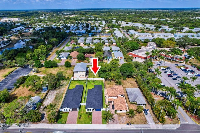 birds eye view of property featuring a residential view and a water view