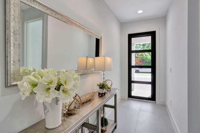 entryway featuring baseboards