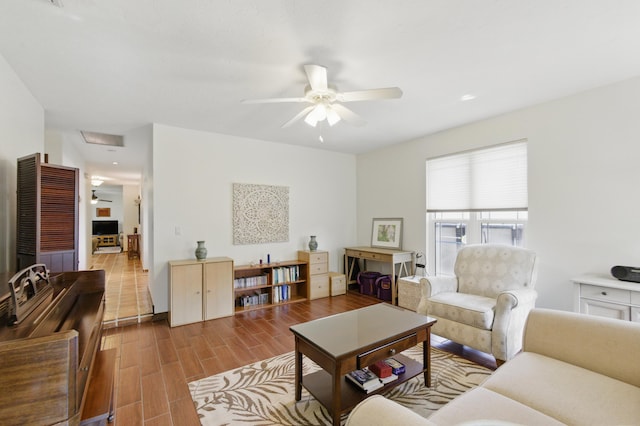 living area featuring wood finished floors and ceiling fan