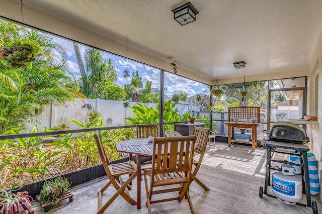 sunroom / solarium with outdoor dining area