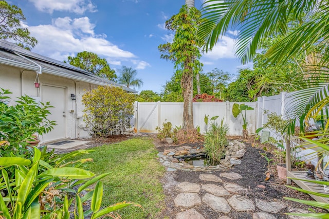 view of yard with a fenced backyard