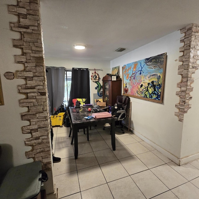 office featuring visible vents, baseboards, and light tile patterned floors