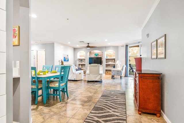 living area featuring crown molding, ceiling fan, baseboards, and recessed lighting
