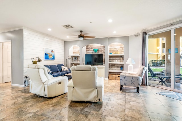 living area with recessed lighting, ornamental molding, arched walkways, and ceiling fan