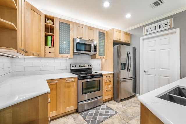 kitchen with stainless steel appliances, open shelves, crown molding, backsplash, and glass insert cabinets