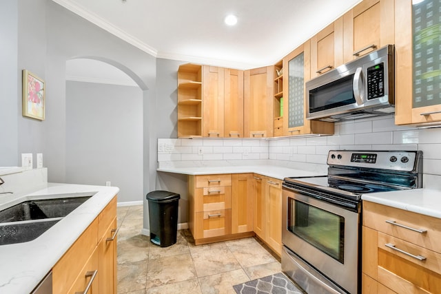 kitchen with appliances with stainless steel finishes, open shelves, ornamental molding, backsplash, and a sink