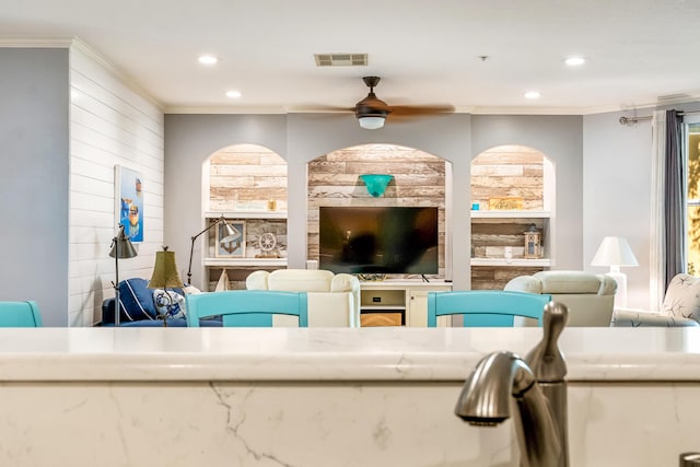 living room with crown molding, recessed lighting, and ceiling fan