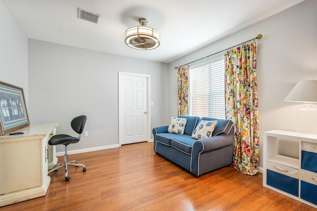 office featuring wood finished floors and baseboards