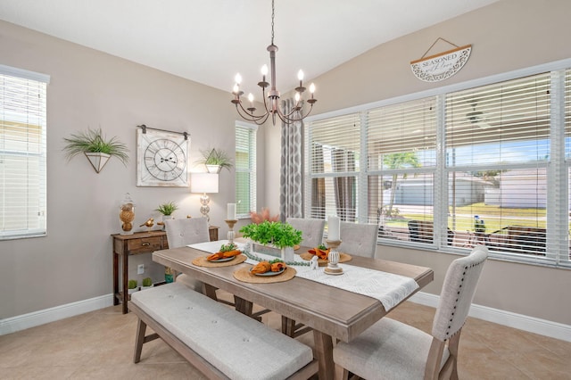 10327 SW W Park Ave, Port Saint Lucie, FL 34987 - dining space featuring light tile patterned floors, a chandelier, vaulted ceiling, and baseboards