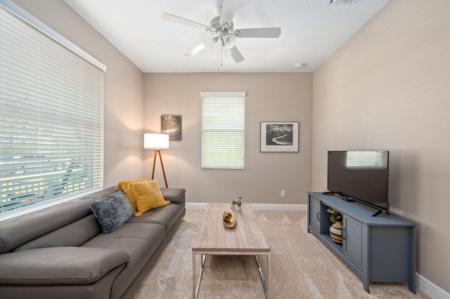 10327 SW W Park Ave, Port Saint Lucie, FL 34987 - living area featuring healthy amount of natural light, ceiling fan, light carpet, and baseboards