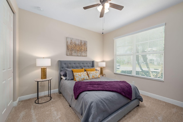 10327 SW W Park Ave, Port Saint Lucie, FL 34987 - carpeted bedroom with baseboards, a ceiling fan, and a closet