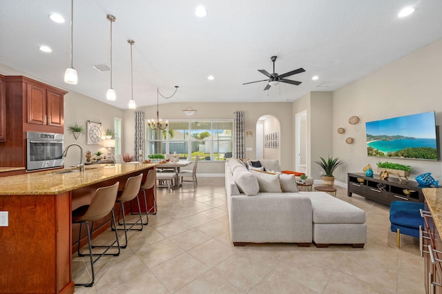 10327 SW W Park Ave, Port Saint Lucie, FL 34987 - living room with recessed lighting, arched walkways, baseboards, a ceiling fan, and light tile patterned floors