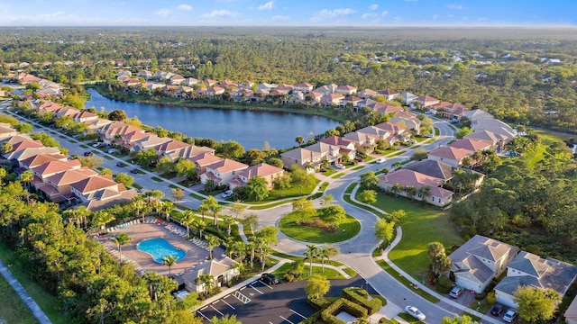 birds eye view of property with a residential view and a water view