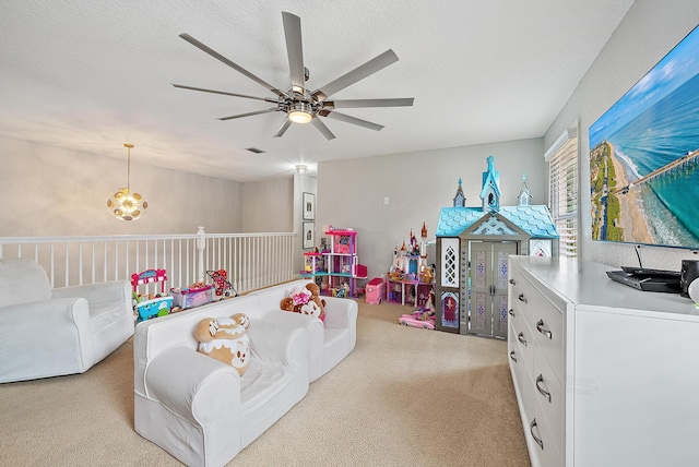 5769 SE Crooked Oak Ave, Hobe Sound, FL 33455 - recreation room featuring light colored carpet, a ceiling fan, and a textured ceiling