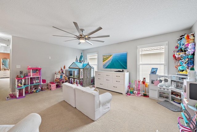 5769 SE Crooked Oak Ave, Hobe Sound, FL 33455 - game room featuring carpet flooring, ceiling fan, and a textured ceiling