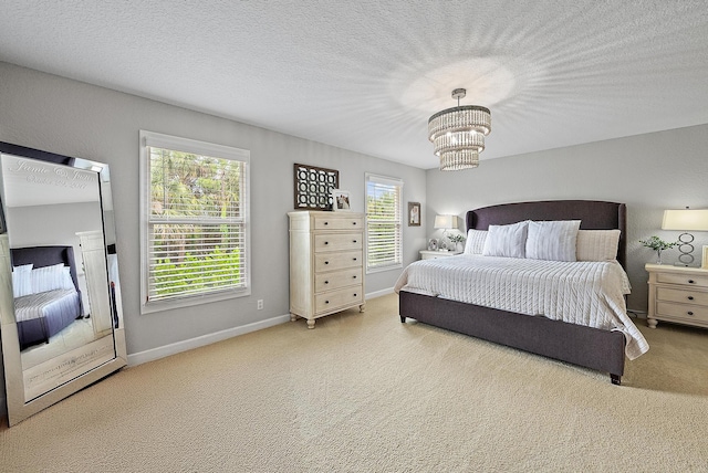 5769 SE Crooked Oak Ave, Hobe Sound, FL 33455 - bedroom featuring multiple windows, carpet, and a chandelier
