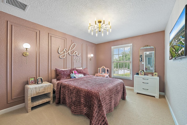 5769 SE Crooked Oak Ave, Hobe Sound, FL 33455 - bedroom featuring light colored carpet, a chandelier, a textured ceiling, a textured wall, and baseboards