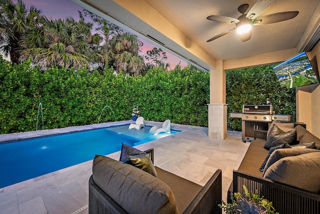 pool featuring ceiling fan, a patio area, and grilling area