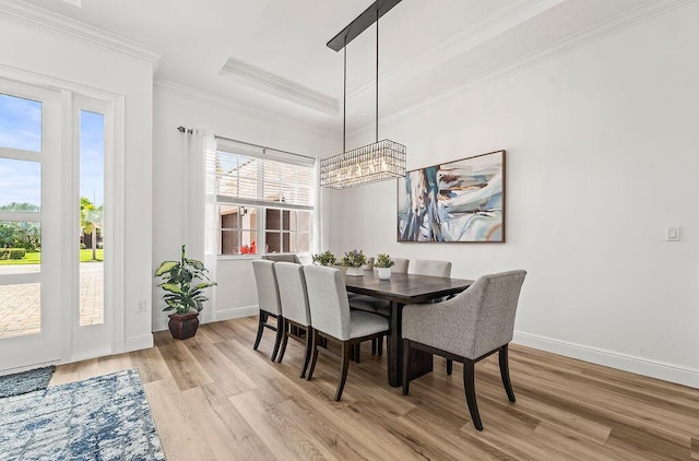 132 Steeple Cir, Jupiter, FL 33458 - dining space featuring a chandelier, light wood finished floors, healthy amount of natural light, and ornamental molding