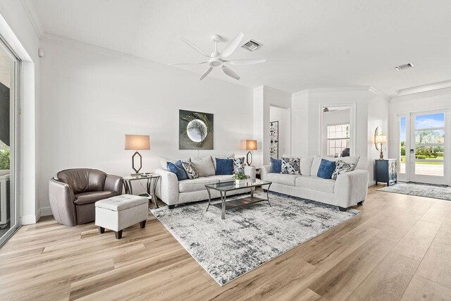 132 Steeple Cir, Jupiter, FL 33458 - living area featuring light wood-style flooring, ceiling fan, and crown molding