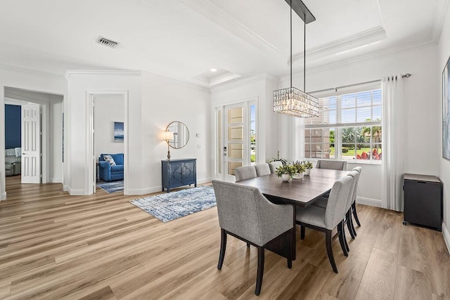 132 Steeple Cir, Jupiter, FL 33458 - dining area featuring light wood-style floors, crown molding, baseboards, and a chandelier
