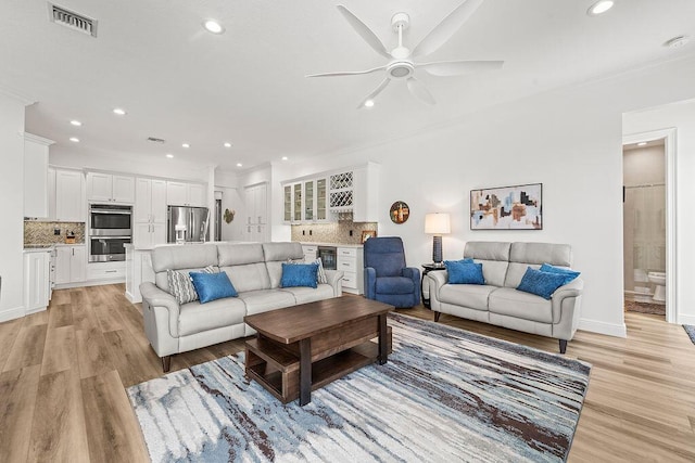 132 Steeple Cir, Jupiter, FL 33458 - living area featuring a ceiling fan, light wood-type flooring, crown molding, recessed lighting, and beverage cooler