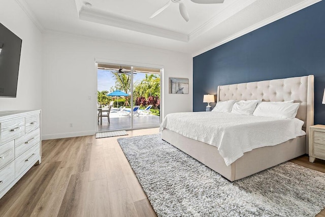 132 Steeple Cir, Jupiter, FL 33458 - bedroom with access to outside, a raised ceiling, wood finished floors, ornamental molding, and ceiling fan