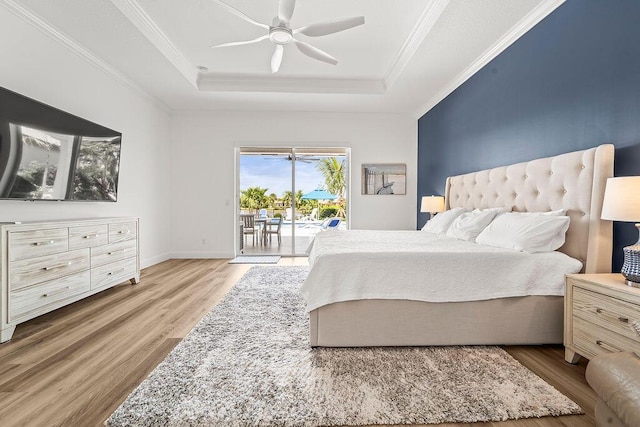 132 Steeple Cir, Jupiter, FL 33458 - bedroom featuring a raised ceiling, access to outside, wood finished floors, crown molding, and ceiling fan